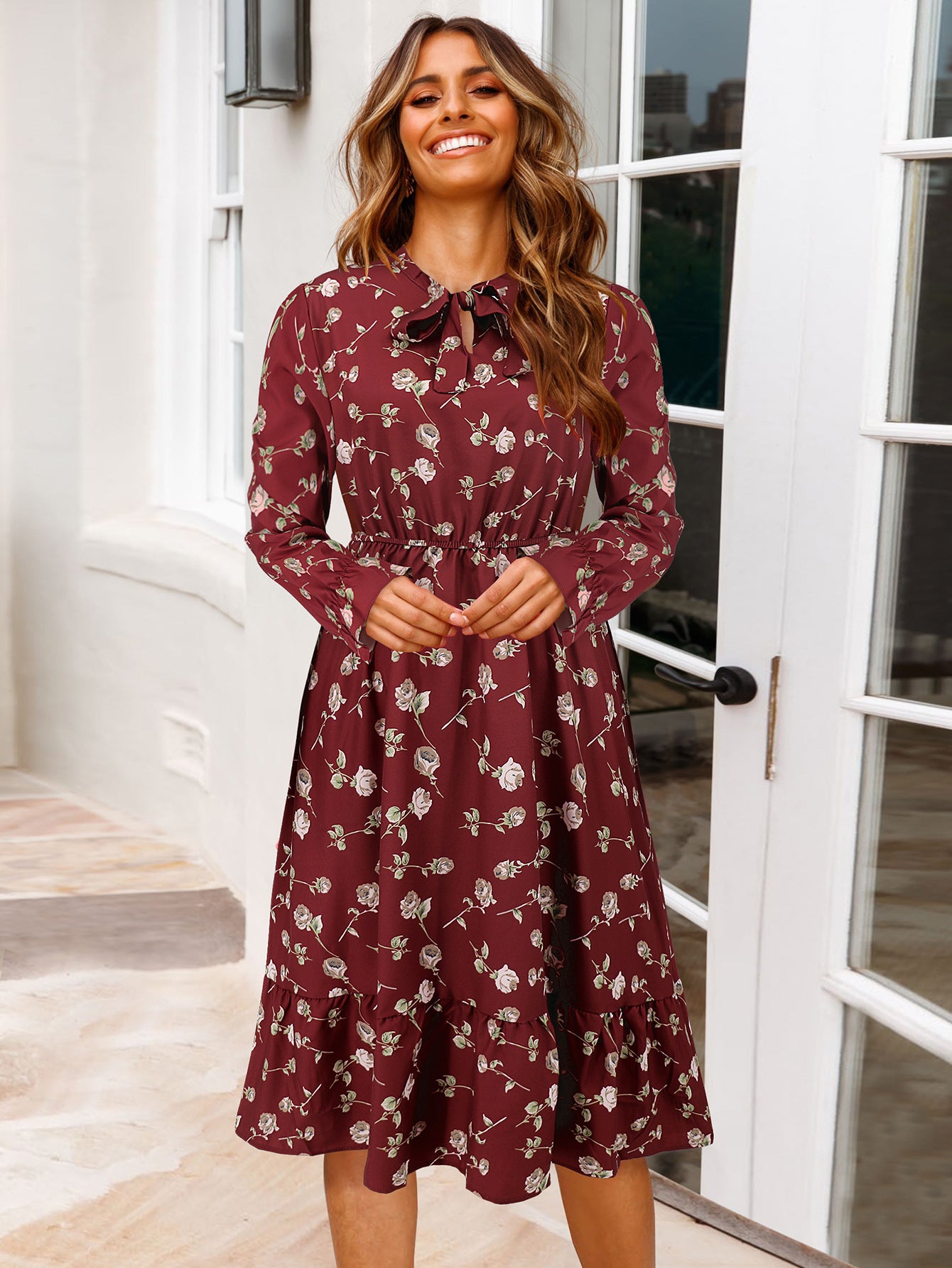 Women's midi dress with playful floral pattern and tie collar Caliora