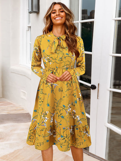 Women's midi dress with playful floral pattern and tie collar Caliora